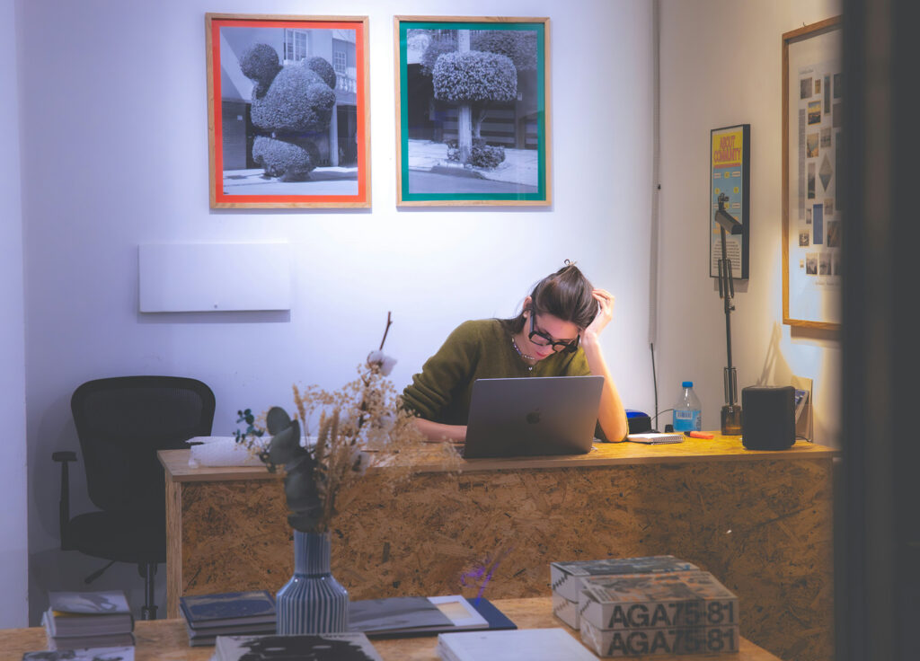 A women in her home office working on their laptop.