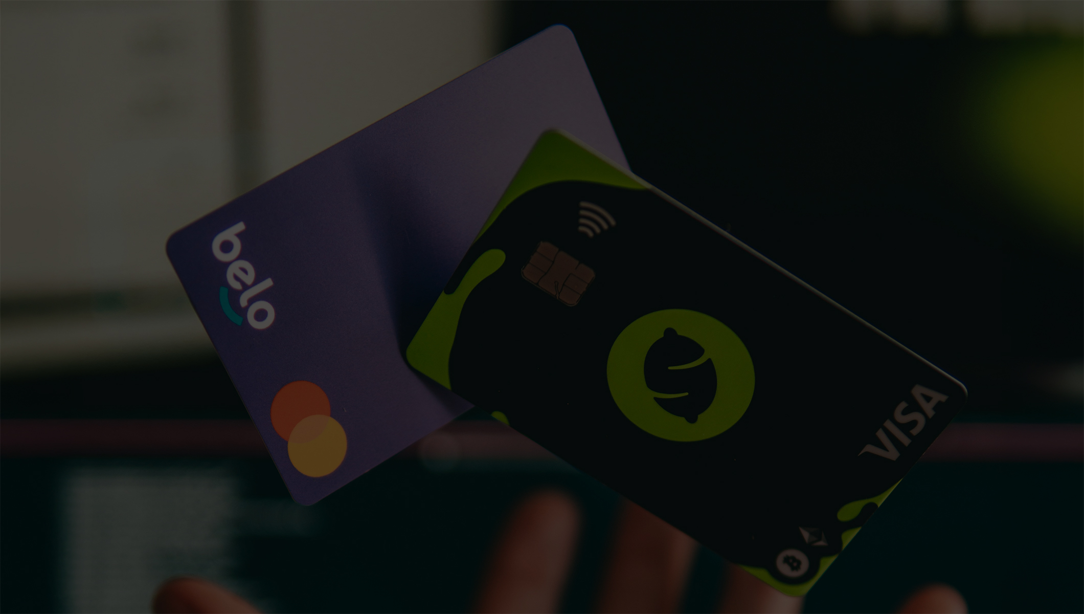 Two credit cards being thrown in the air.